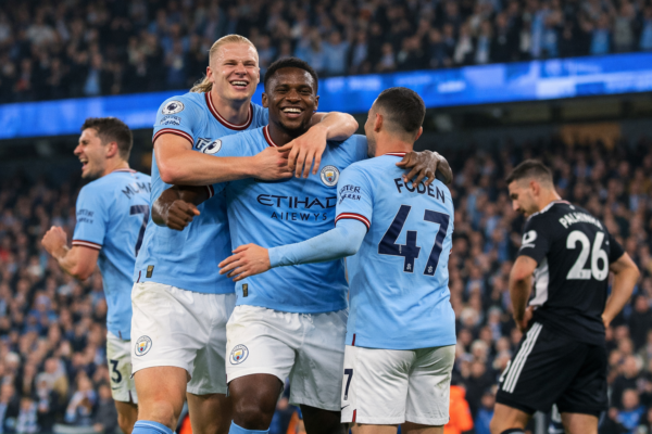Manchester City players celebrate victory over Fulham in Premier League match